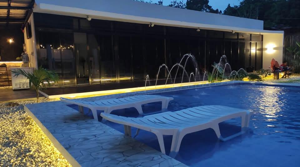 Casa Fria pool illuminated at night